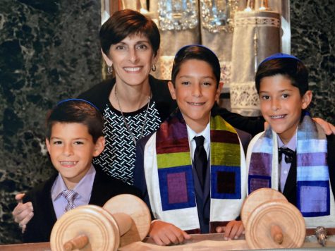 Submitted Photo || Jacob Kurlander
Junior Jacob Kurlander (right) poses for a photo with his mother, Beth Kurlander, twin brother, junior Eli Kurlander (center), and little brother, freshman William Kurlander (left) at his b’nai mitzvah. Jacob had his b’nai mitzvah with his twin brother. 