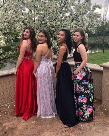 Submitted Photo || Lydia Yong
Senior Lydia Yong (second from the right) poses with her friends in her dark blue prom dress.