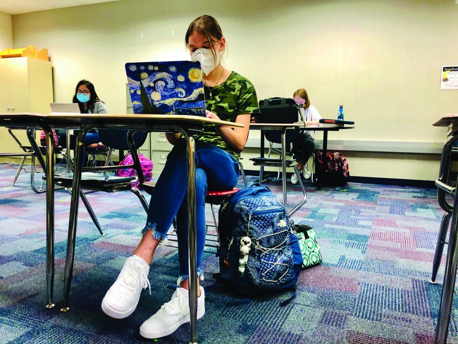 Tsion Daniel

Emily Garnes, Just Write Club member and junior, uses her laptop to write during a free write session for Just Write Club. Garnes said she likes writing poetry, fantasy and short stories.