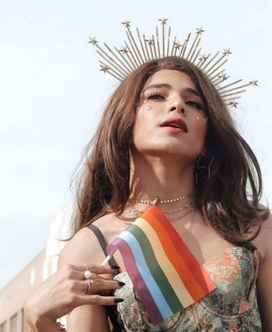 Posing for Pride
Junior Daniel Tanner holds an LGBTQ+ Pride flag and poses for a photo during Indy Pride 2019. He attended the festival in June at Military Park. The event was a festival held to celebrate the LGBTQ+ community and display pride. 