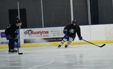 Senior Nash Cheslock does a “hockey stop” during practice with his teammate senior Joseph Youkilis. Cheslock said the practices are complex with different factors to focus on like timing.