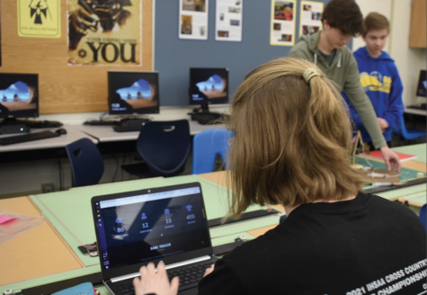 By Marissa Finney
Senior Evie Taller works on her TechHounds assignment during a club meeting. 