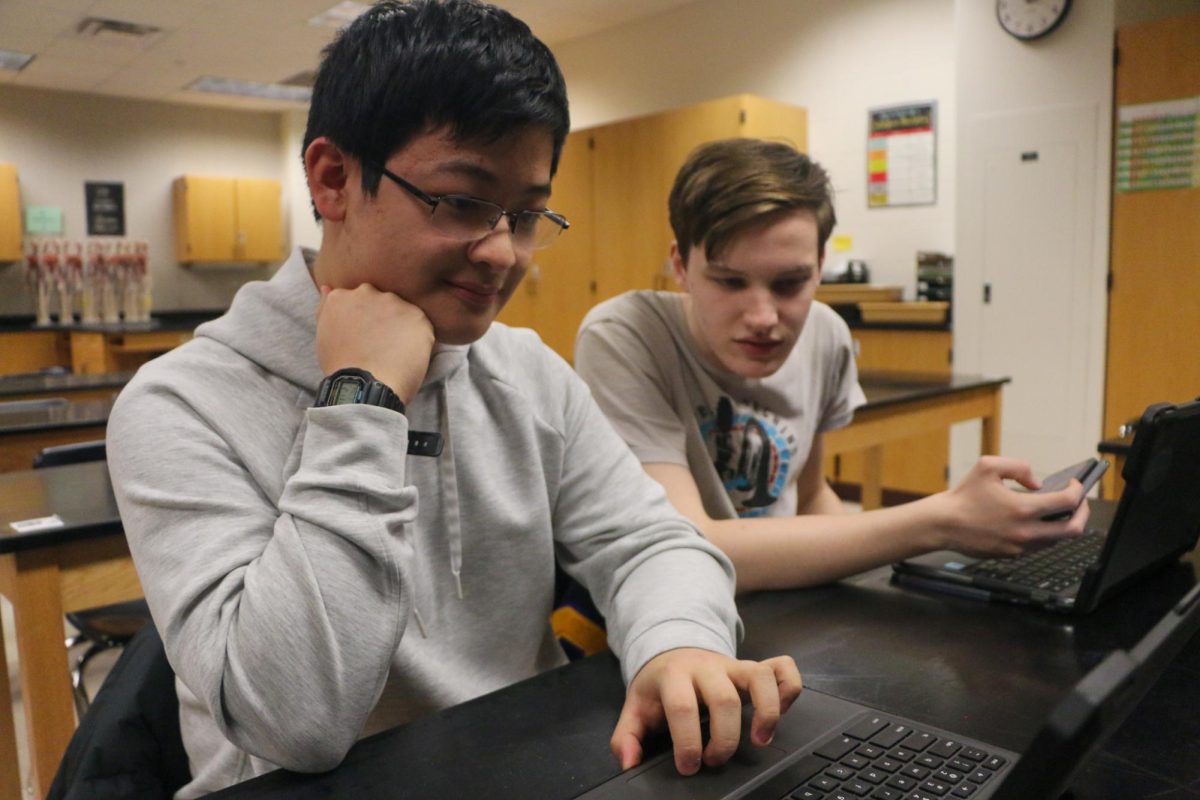 Junior Kyle Yang (left) works on his Chromebook as a classmate sits beside him during SSRT. Students spent extended periods of time working on their Chromebooks as coursework shifted to digital platforms.
